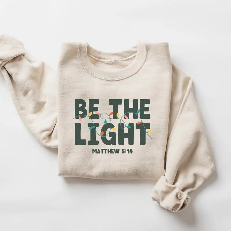 Be The Light Sweatshirt, Religious Christmas Sweatshirt, Christian Holiday Sweater, Faith Based Gift, Christmas Gifted, Festive Apparel T-shirt, sweater and Hoodie