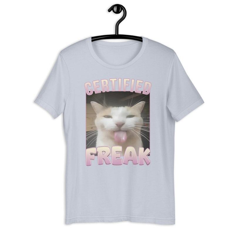 Certified Freak Funny Cat Meme T-Shirt, Ironic Unisex Graphic Apparel, Playful Clothing Gift for Meme Lovers and Quirky Trendsetters