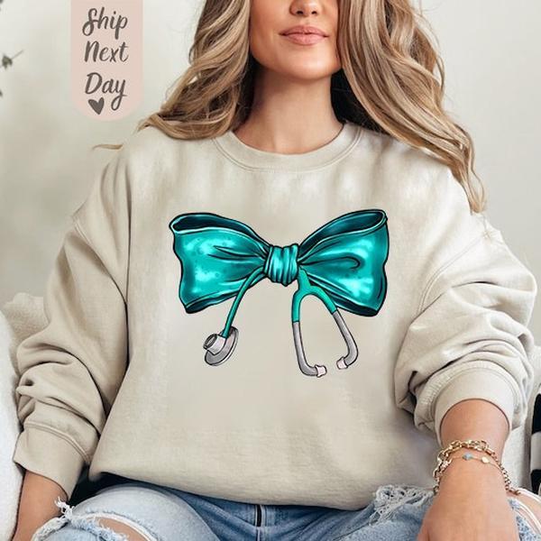 Coquette Nurse Stethoscope Bow Sweatshirt, Nurse Blue Bow Sweater, Nurse Bow Shirt, Gift For Nurse, Unisex Shirt, Full Size, Gift For Her