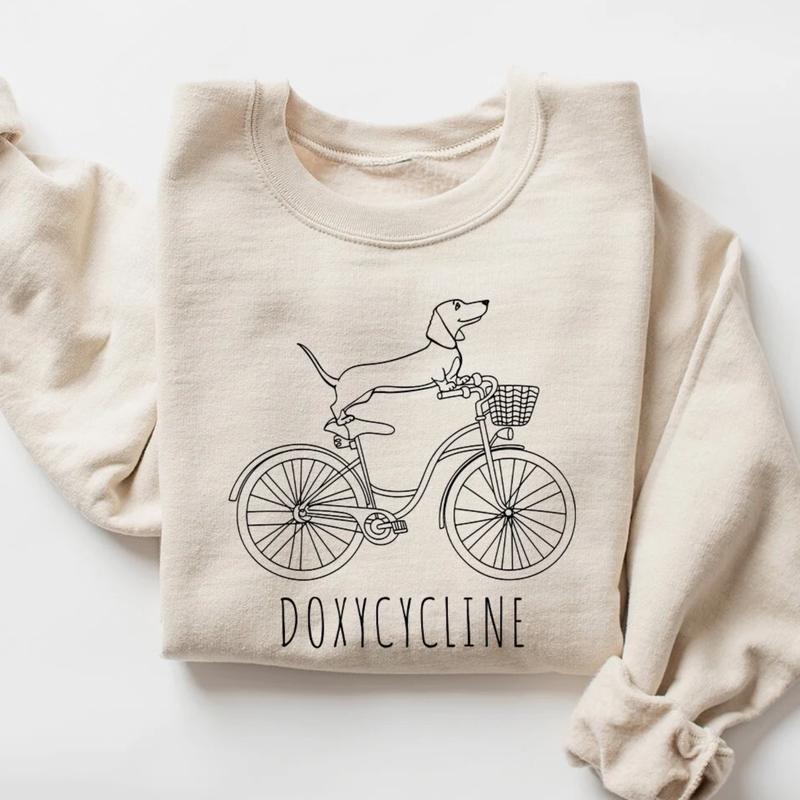 Doxycycline Pharmacy Pun T-shirt - Pharmacists Sweatshirt, Dachshund on Bicycle, Perfect Gift for Pharmacists & Technicians sweatshirts