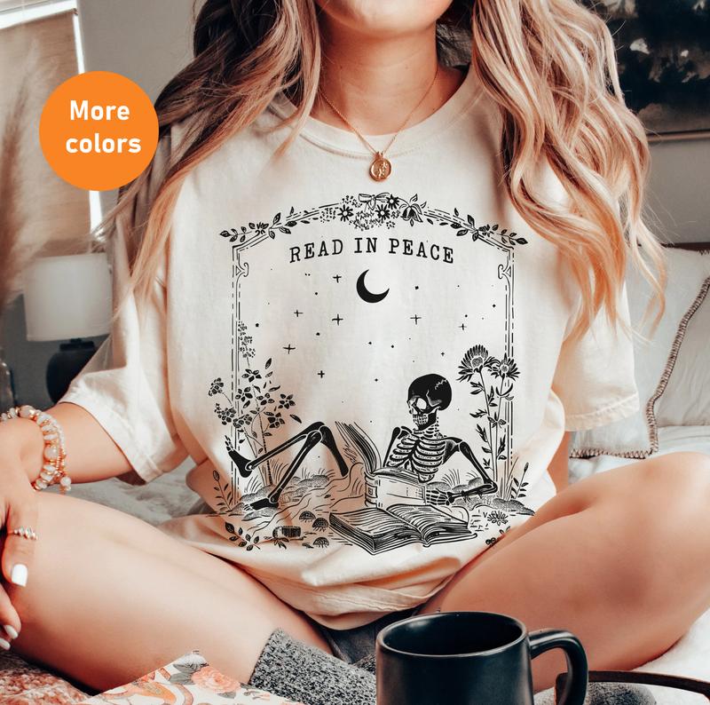 Read in Peace Shirt Ã¢â‚¬â€œ Skeleton Book Lover Halloween Tee, Perfect for Bookish Ghoul, Unisex T-shirt, Gift for Him, Gift for Her, Crew Neck, Trending T-