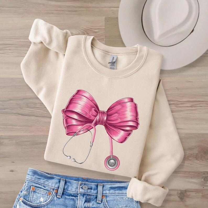 Coquette Nurse Stethoscope Bow Sweatshirt, Healthcare Worker, Nurse Appreciation, Nursing School, Future Nurse, Unisex Shirt, Gift For Her, Gift For H